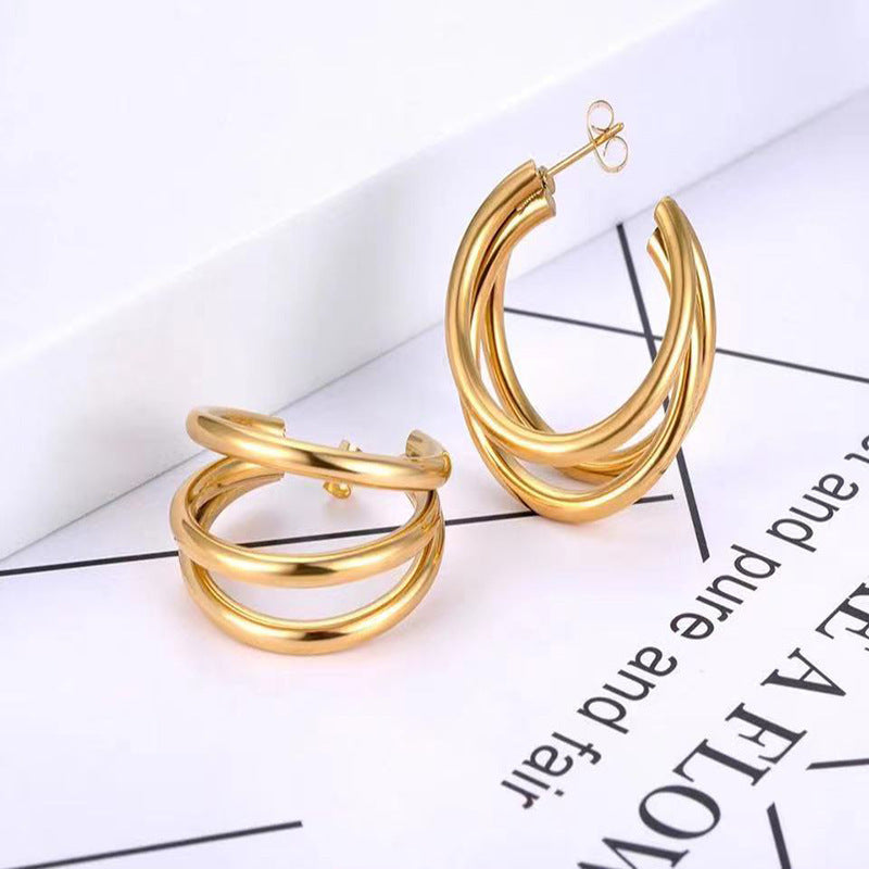 Boucles d'oreilles N multicouches en acier titane