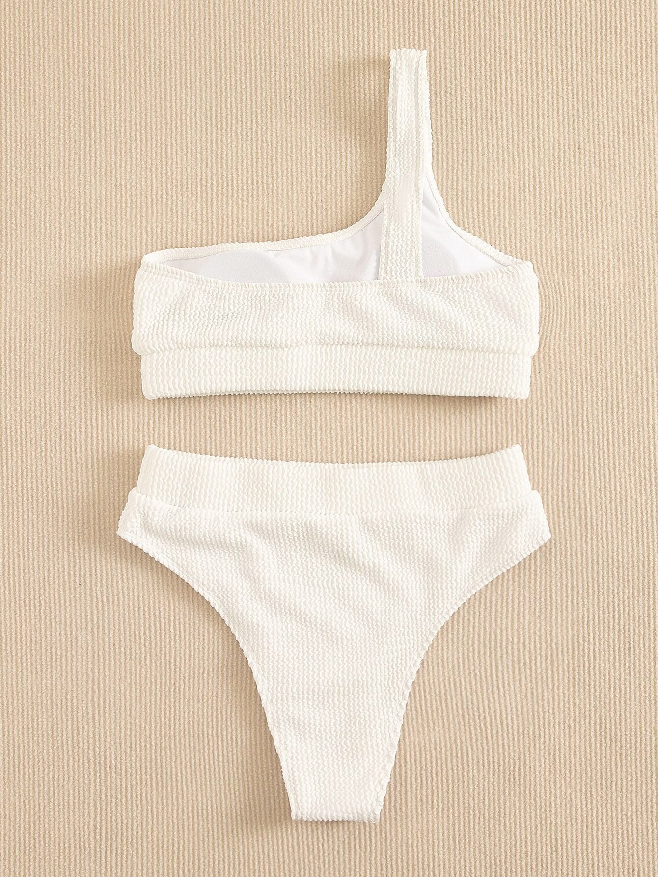 Dame sexy en maillot de bain bikini de couleur unie une épaule