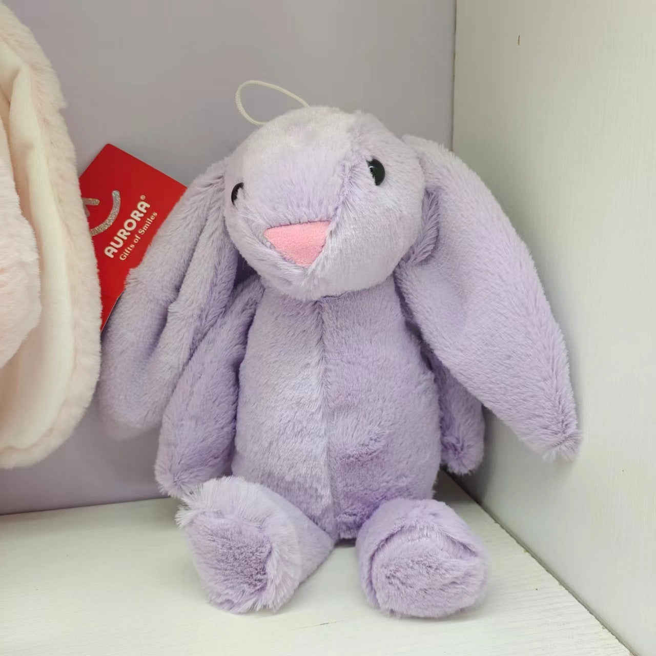 Juguete de peluche de conejo de orejas caídas lindo y creativo