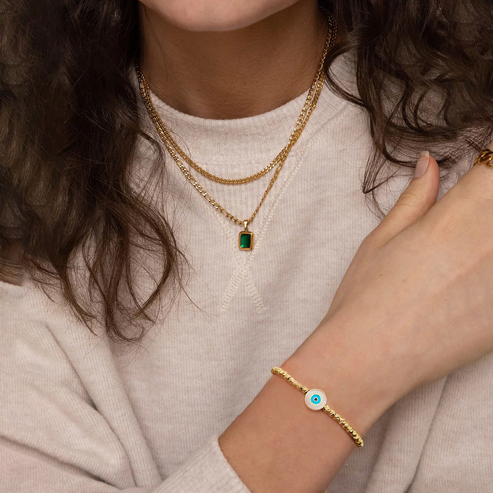 Pulsera Lucky Blue Eyes de oro bañado en cobre de 18 quilates con cuentas