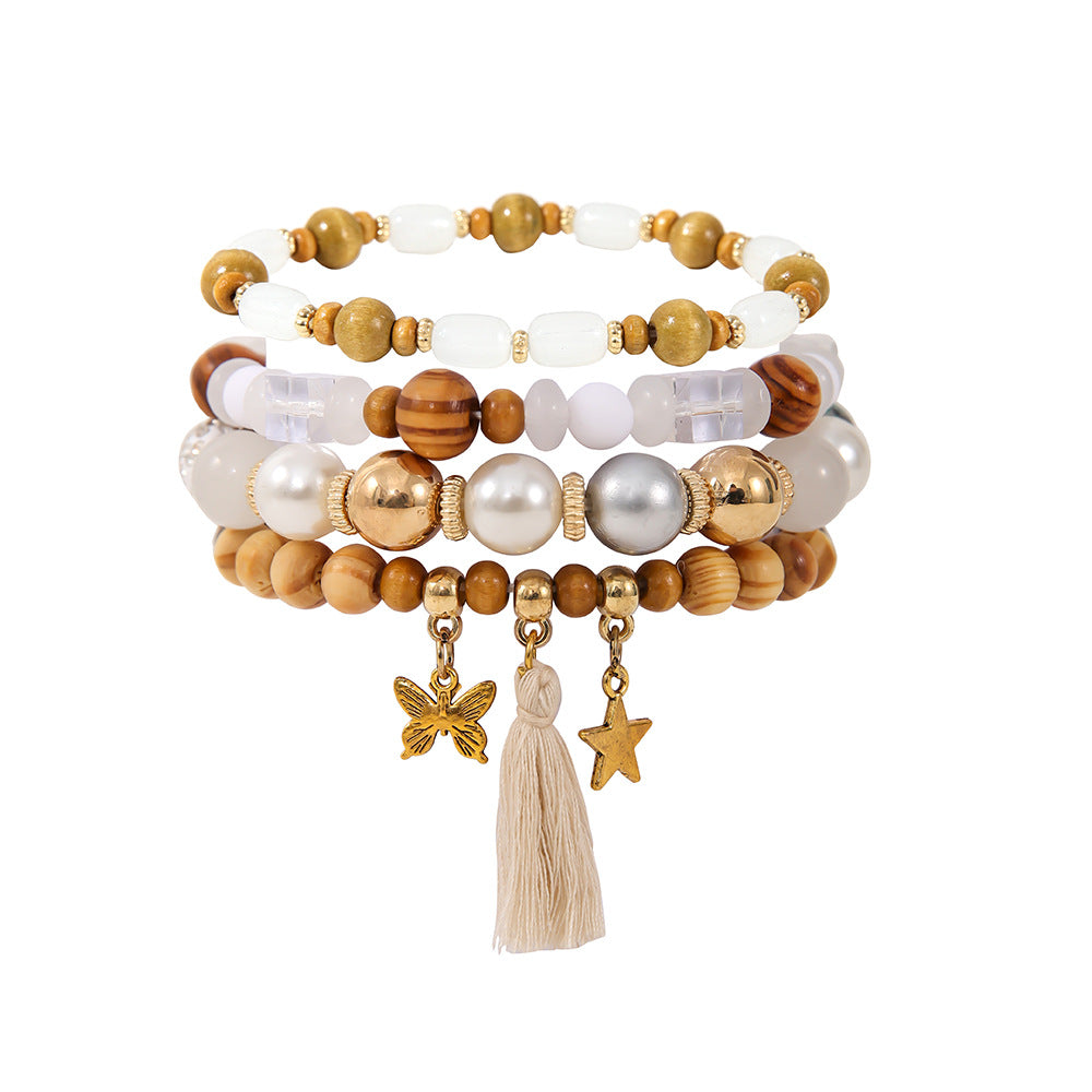 Costume de bracelet ethnique en perles de bois et pompon
