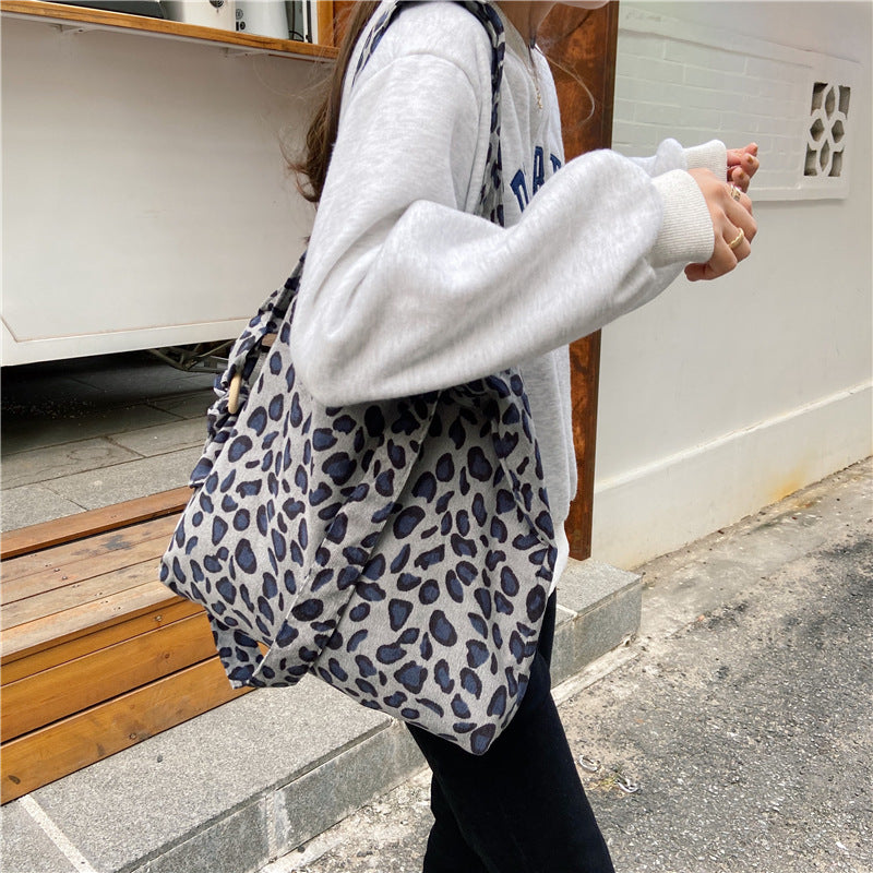 Sac messager rose rétro artistique simple de grande capacité