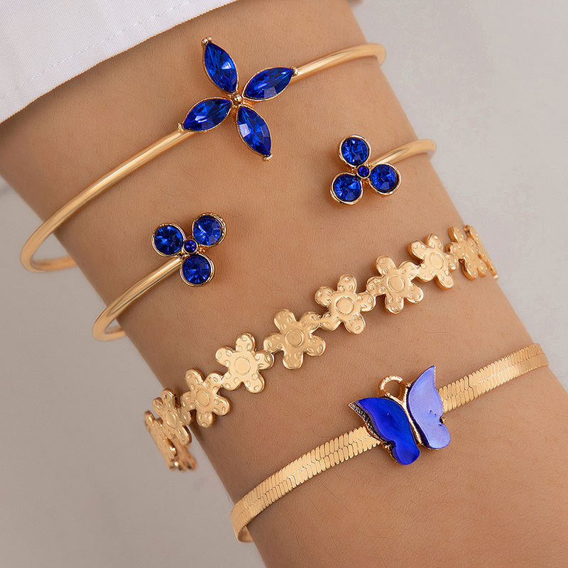 Bracelet à quatre couches creux clouté de diamants papillon bleu