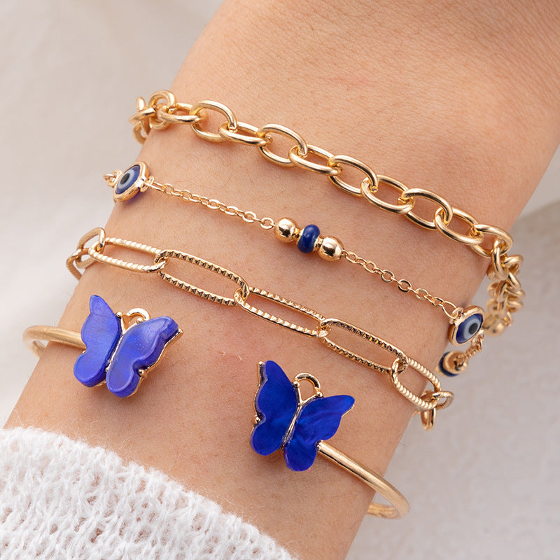 Bracelet à quatre couches creux clouté de diamants papillon bleu
