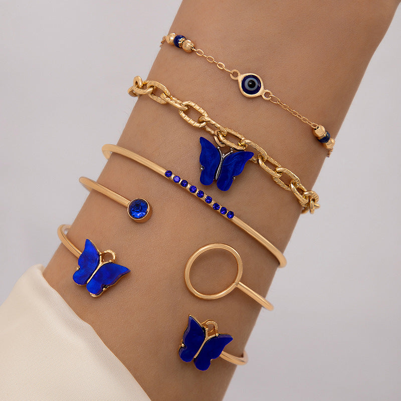 Bracelet à quatre couches creux clouté de diamants papillon bleu