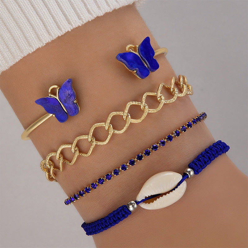 Bracelet à quatre couches creux clouté de diamants papillon bleu