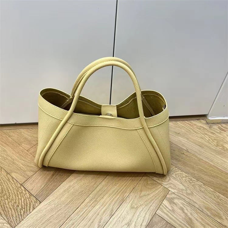 Combinación de transporte de mano tipo bandolera de cuero suave con patrón de lichi