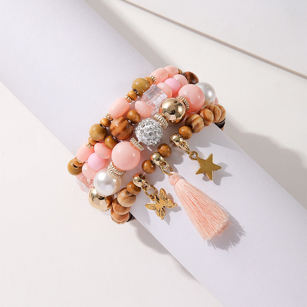 Costume de bracelet ethnique en perles de bois et pompon