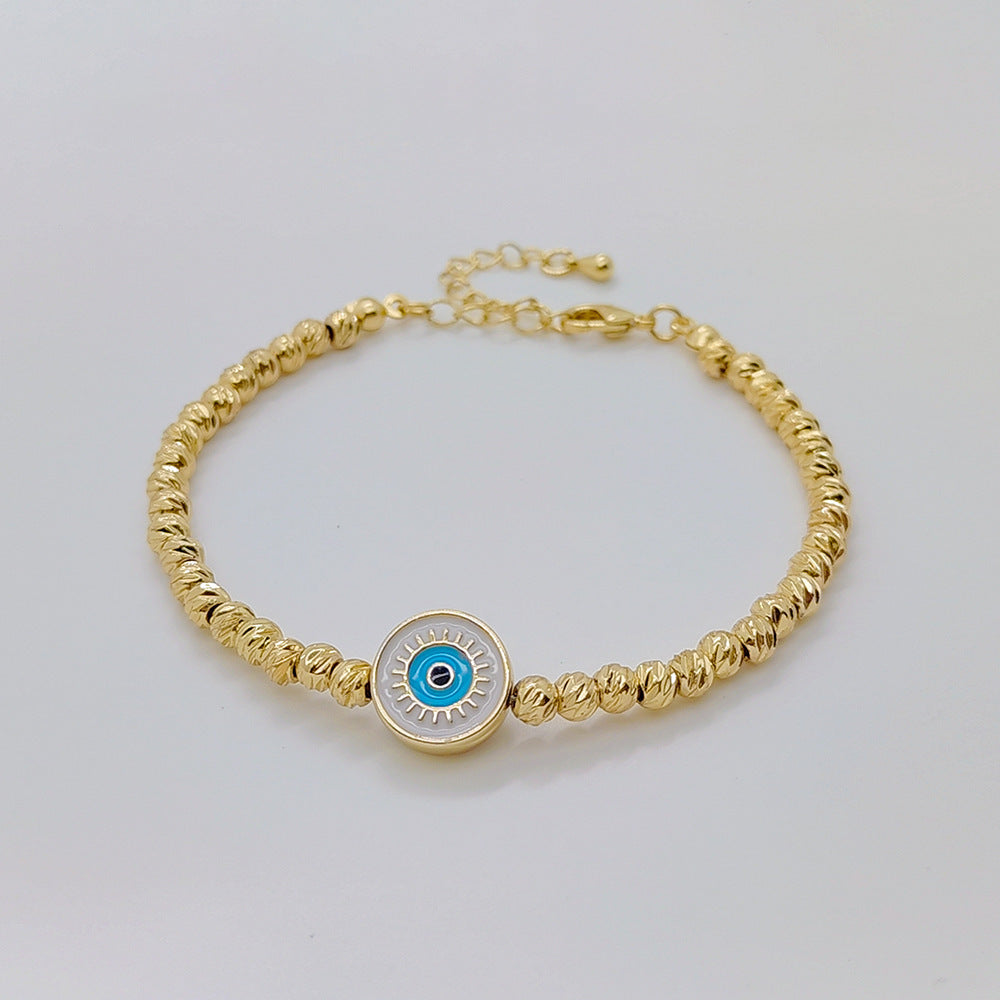 Pulsera Lucky Blue Eyes de oro bañado en cobre de 18 quilates con cuentas
