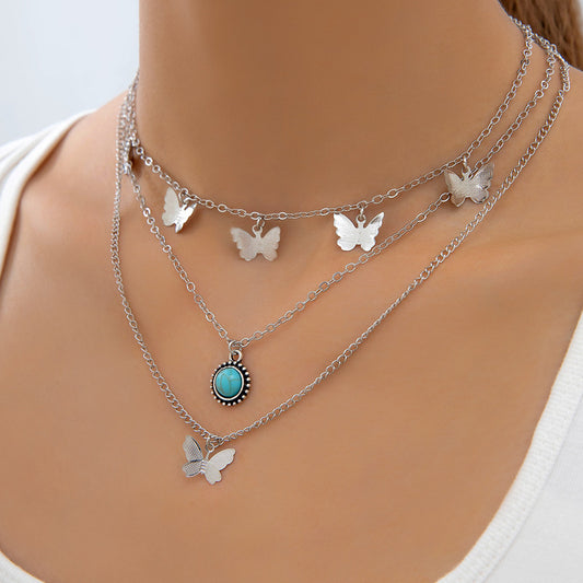 Collier multicouche pour femmes, ornement de Style ethnique rétro, pampilles en alliage Simple, papillon incrusté de Turquoise