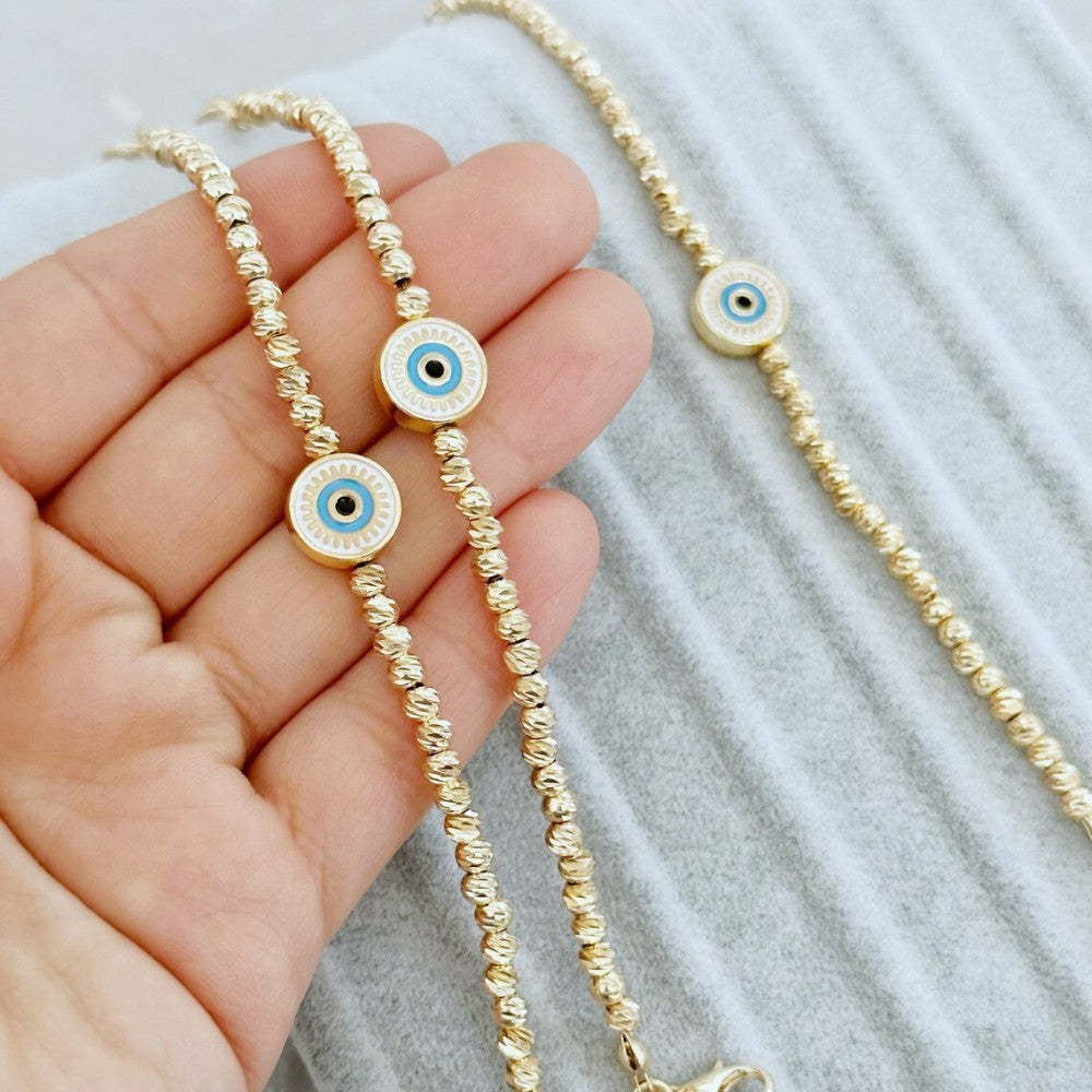Pulsera Lucky Blue Eyes de oro bañado en cobre de 18 quilates con cuentas