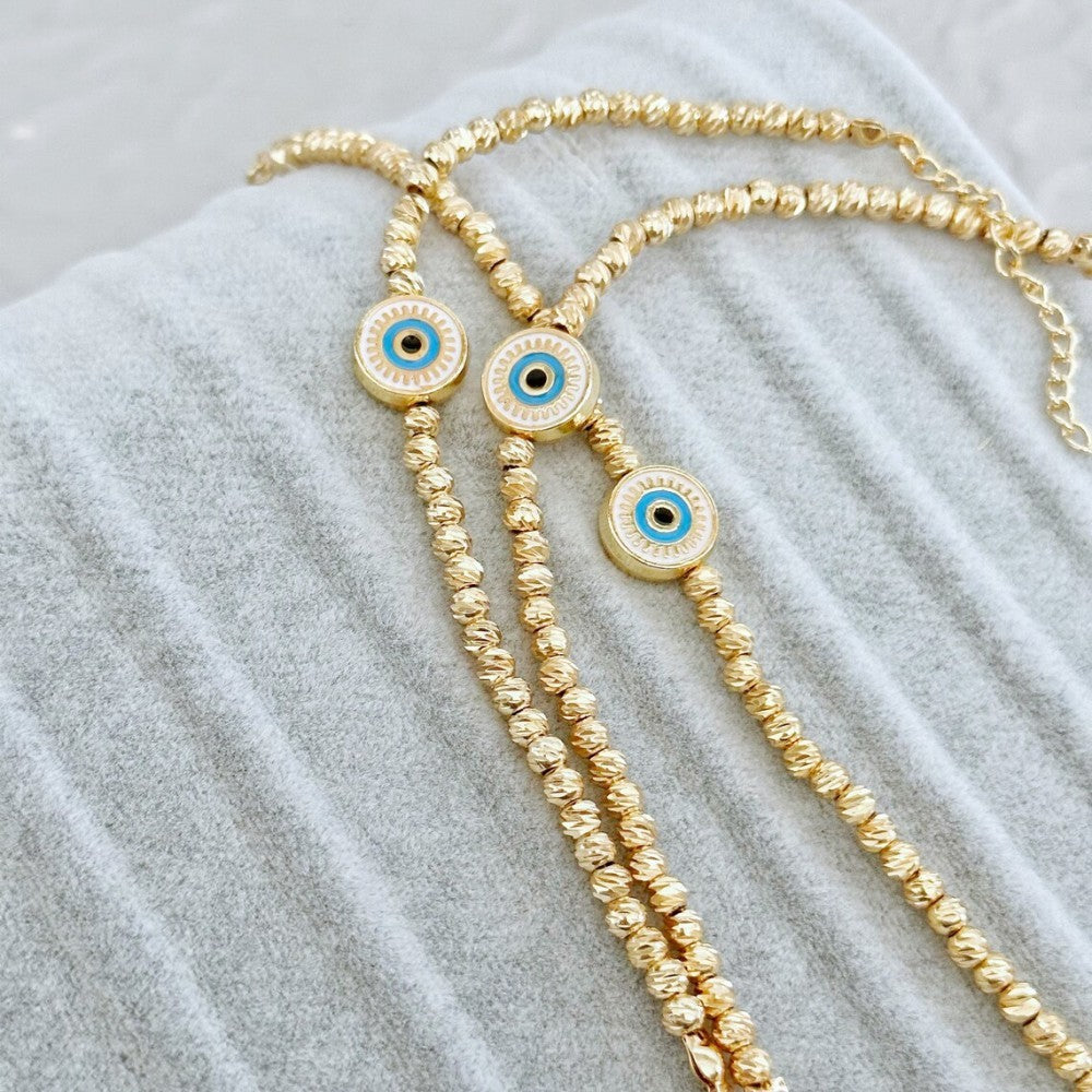 Pulsera Lucky Blue Eyes de oro bañado en cobre de 18 quilates con cuentas