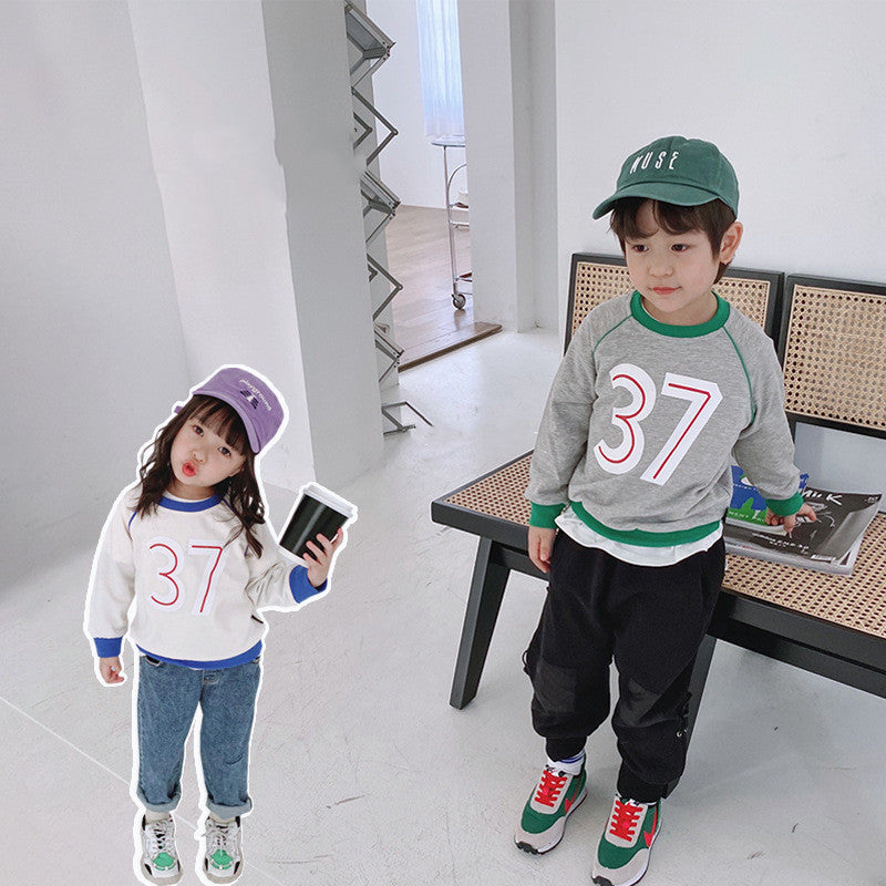 Ropa para niños al por mayor otoño nuevos niños suéter de cuello redondo niña bebé 37 letras color a juego suéter de niños coreanos