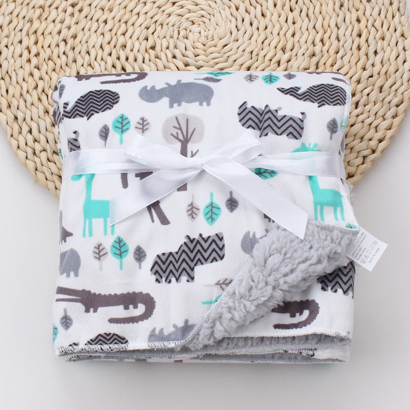 Manta de bebé con estampado de dibujos animados.