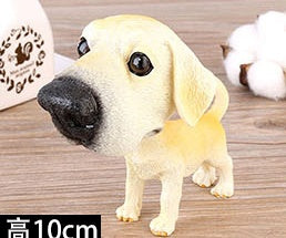Figurines de chiot secouant la tête