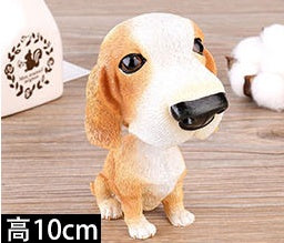Figurines de chiot secouant la tête