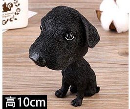 Figurines de chiot secouant la tête
