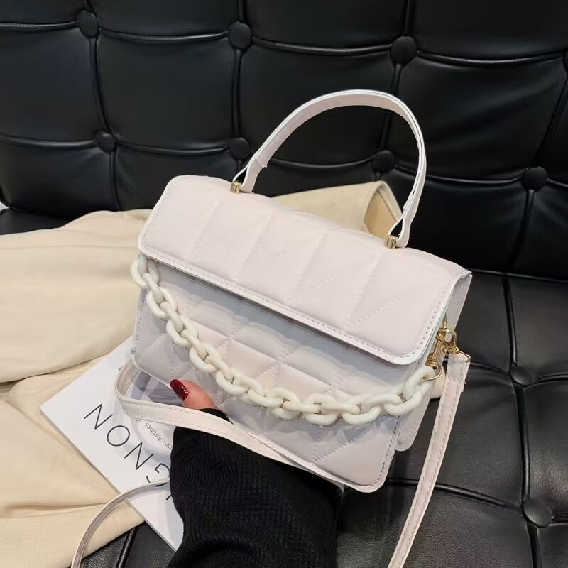 Bolso bandolera de hombro con textura simple y moderno