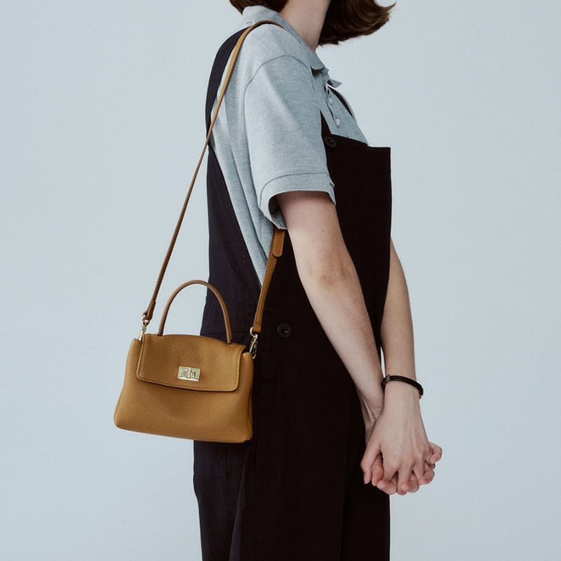 Mini sac portable en cuir de vache de première couche