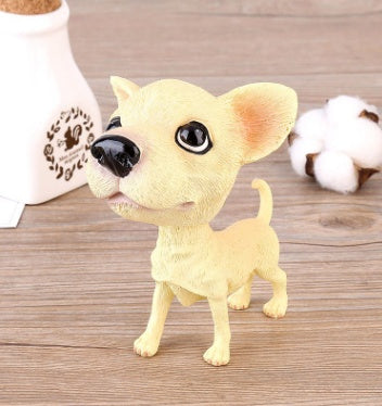Figurines de chiot secouant la tête