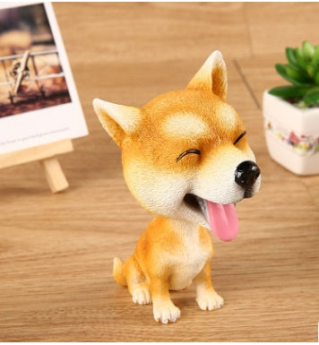 Figurines de chiot secouant la tête