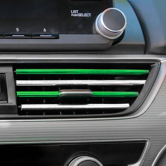 Tira decorativa para salida de aire del automóvil.