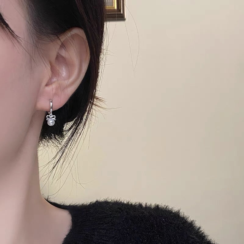 Boucles d'oreilles en perles artificielles avec nœud exquis