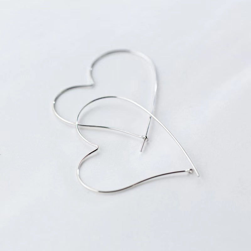 Boucles d'oreilles creuses en forme de cœur, personnalité gracieuse à la mode