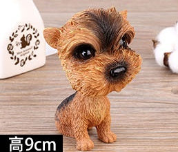 Figurines de chiot secouant la tête
