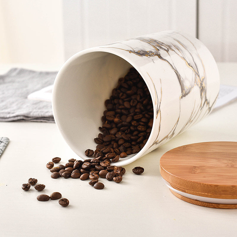 Tarro hermético con tapa de madera de cerámica veteada.