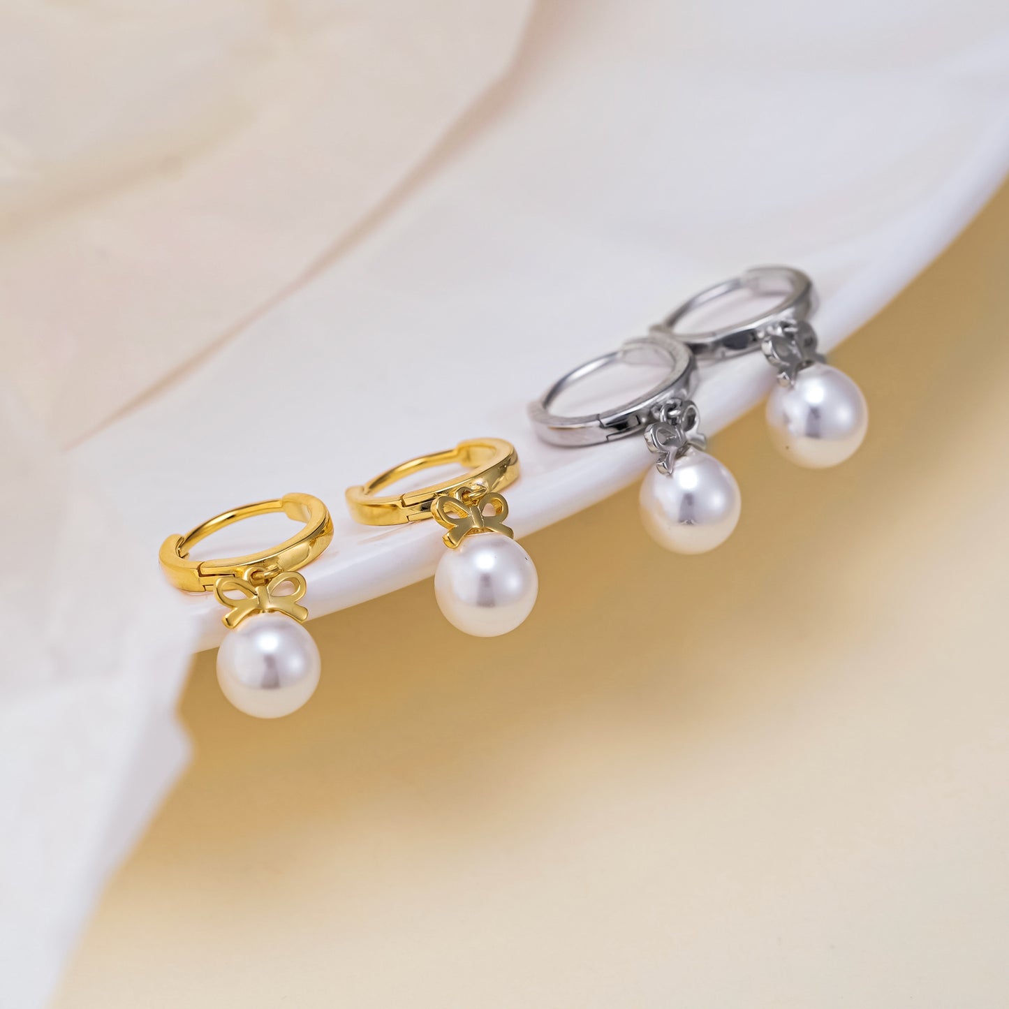 Boucles d'oreilles en perles artificielles avec nœud exquis