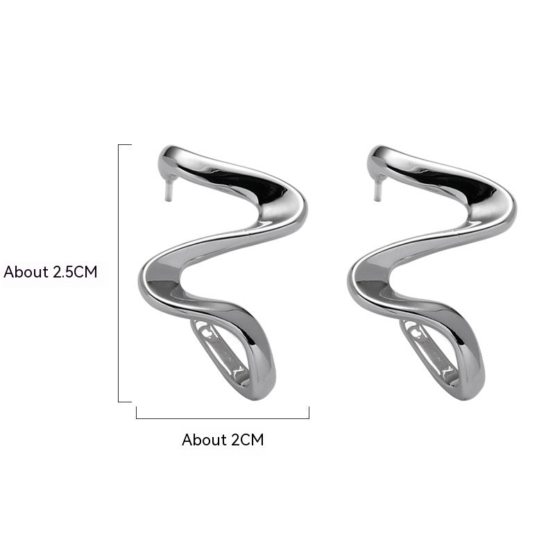 Niche de boucles d’oreilles abstraites posées en spirale