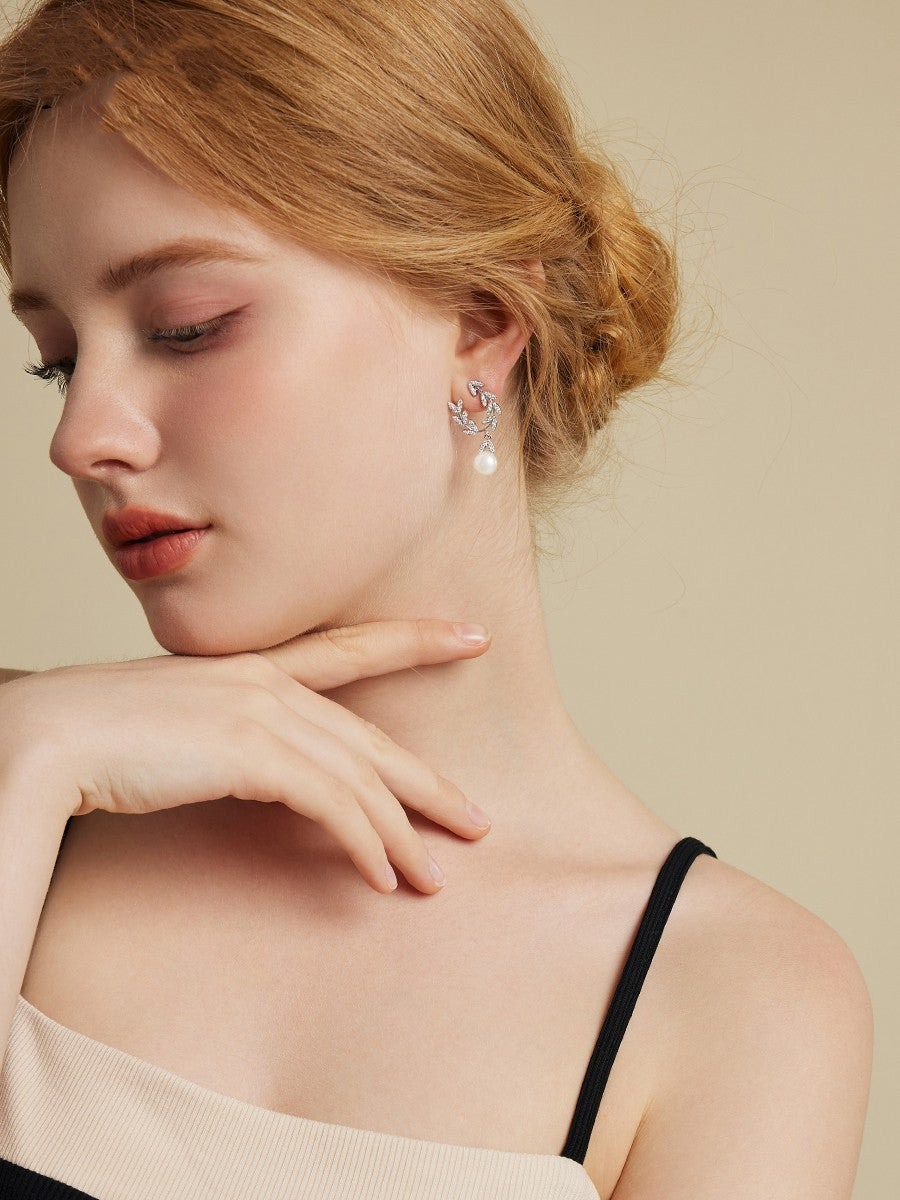 Boucles d'oreilles en perles de feuilles d'aiguille en argent à la mode