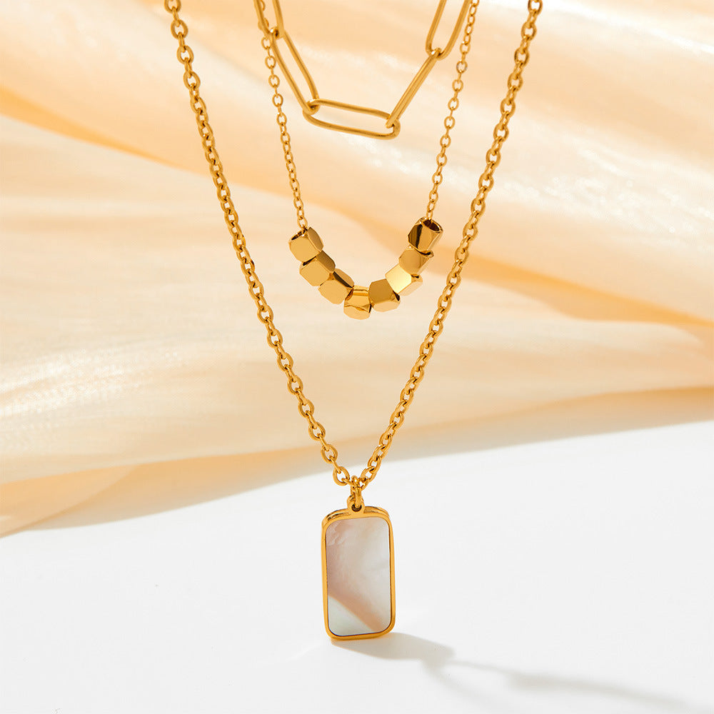 Collar de concha blanca rectangular hueco gemelo de tres capas