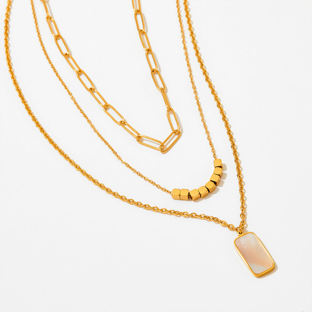 Collar de concha blanca rectangular hueco gemelo de tres capas
