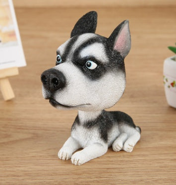 Figurines de chiot secouant la tête