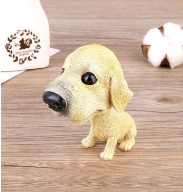 Figurines de chiot secouant la tête