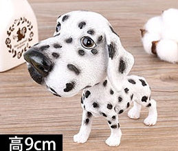 Figurines de chiot secouant la tête