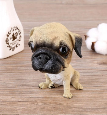 Figurines de chiot secouant la tête