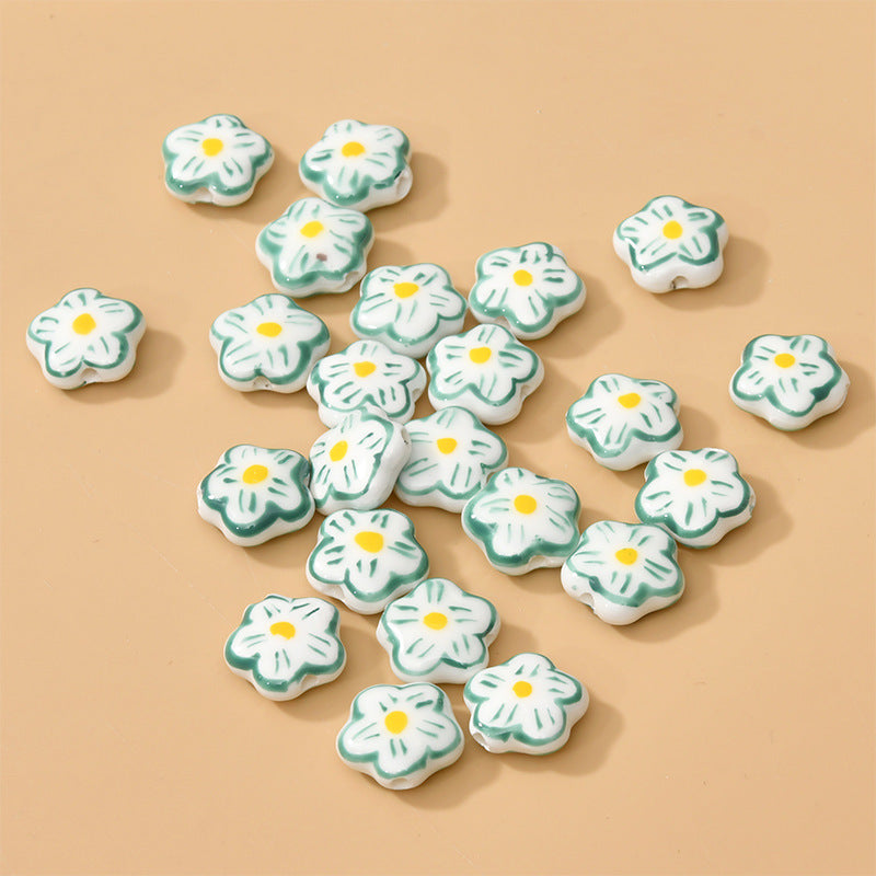 Petite fleur de cerisier peinte à la main en porcelaine, perles à trou droit, perles éparpillées