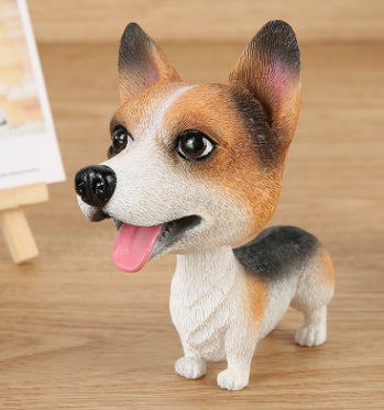 Figurines de chiot secouant la tête