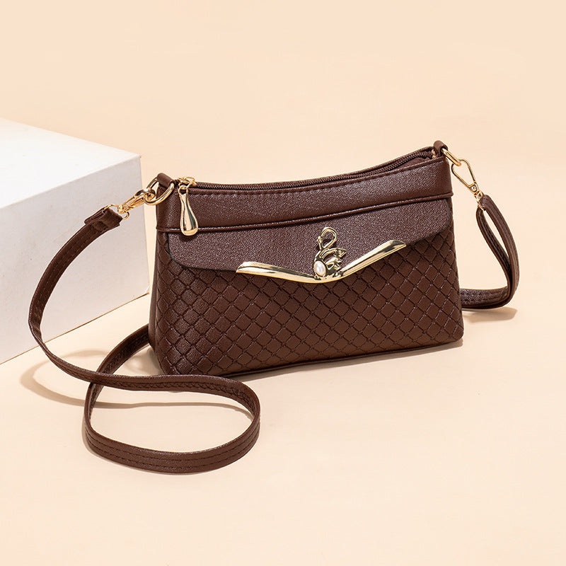 Práctico bolso bandolera con relieve Lingge