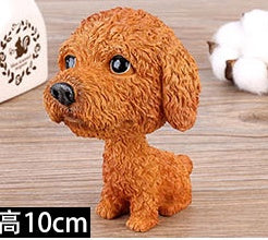 Figurines de chiot secouant la tête