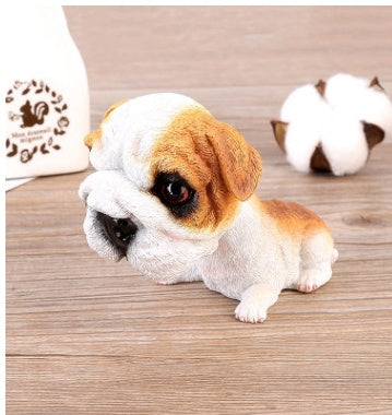 Figurines de chiot secouant la tête