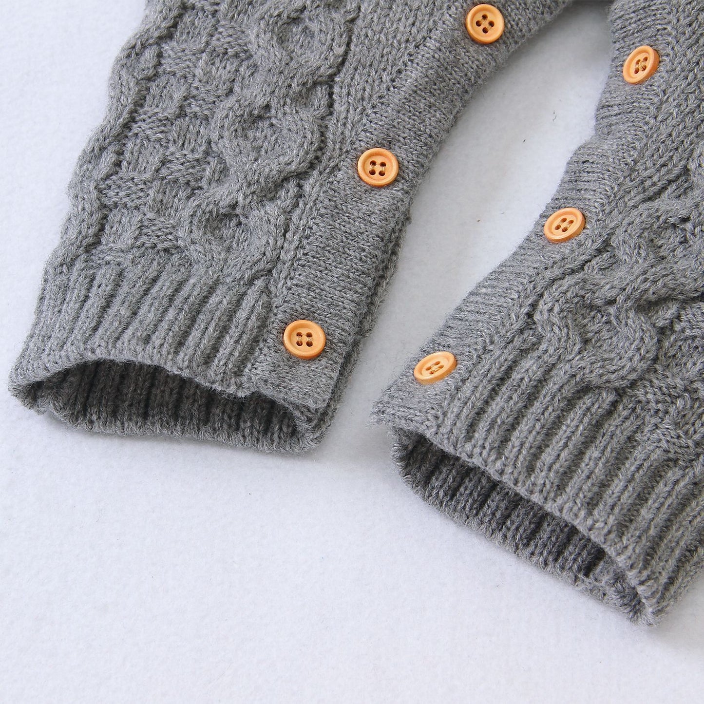 Combinaison bébé tricotée couleur unie