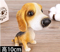 Figurines de chiot secouant la tête