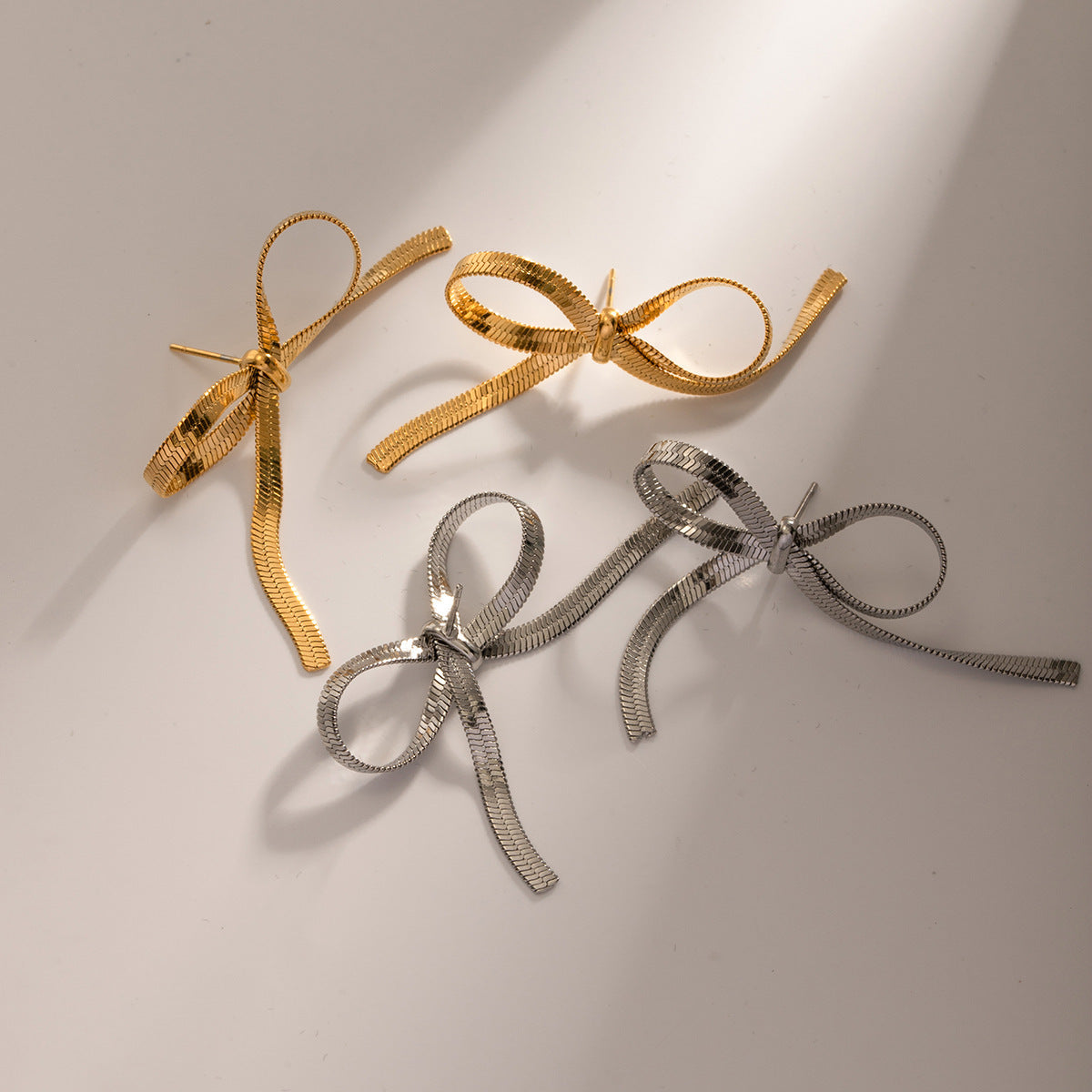 European And American Ins Style Graceful Personality 18K Gold Stainless Steel Chain Like Flat Snake Bow Earrings