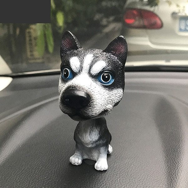 Figurines de chiot secouant la tête