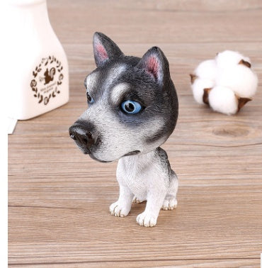 Figurines de chiot secouant la tête