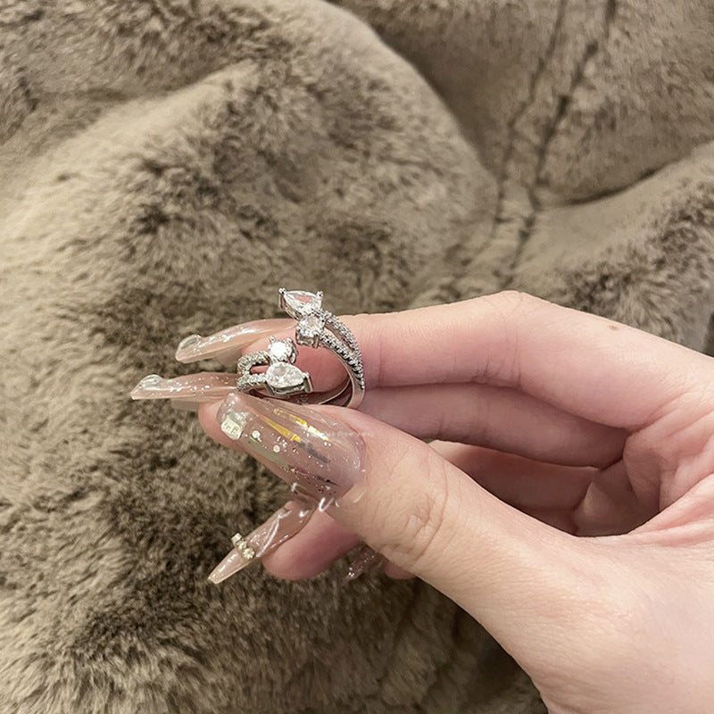 Anillo abierto de doble capa con gotas de agua y circón de viento frío